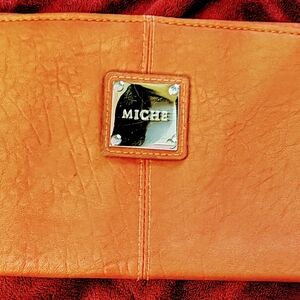 MICHE Orange Purse Cover. In Great Condition.